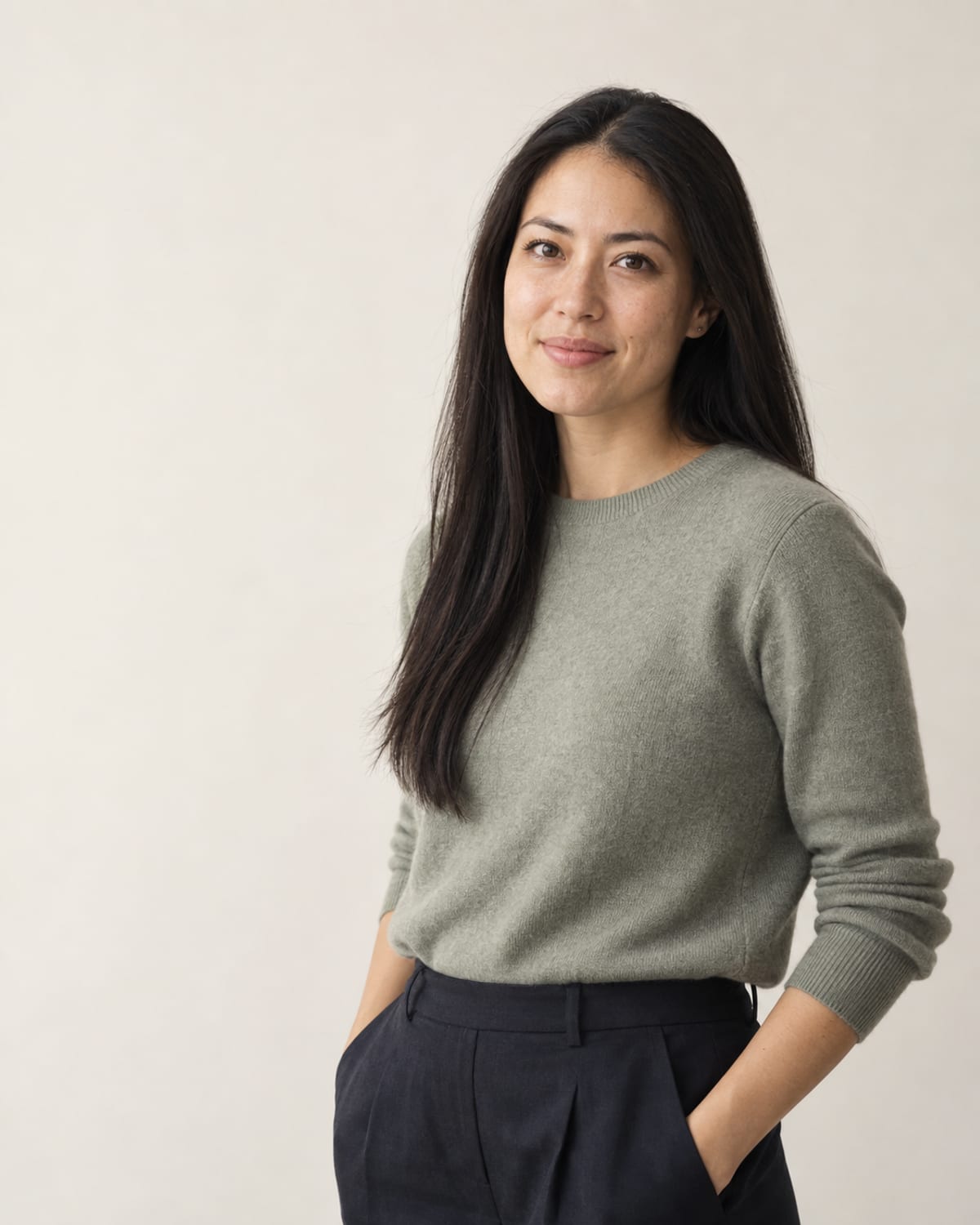 AI-generated layout placeholder portrait of a woman with long straight black hair; replace before launch.